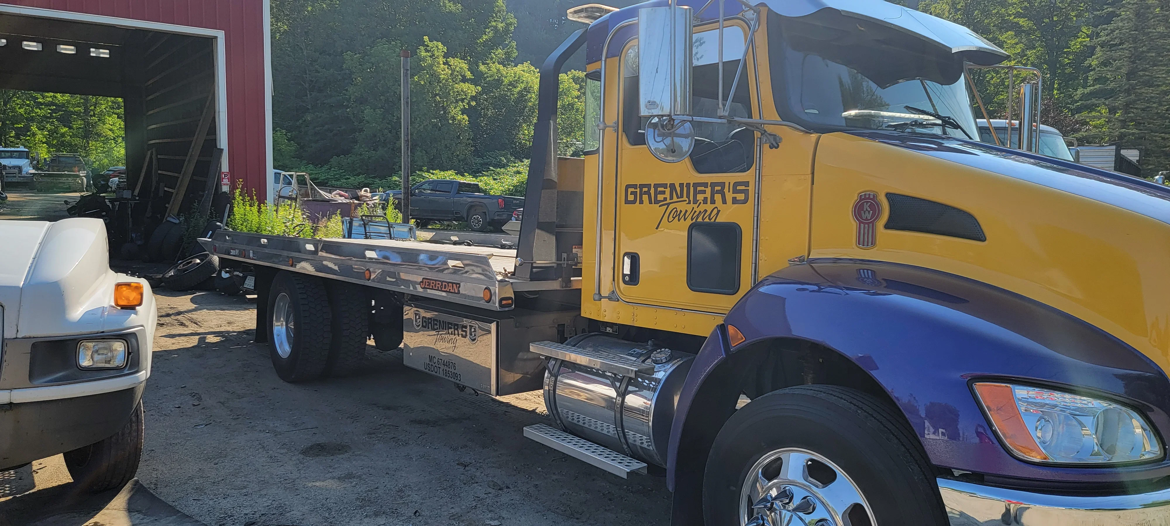Grenier's Towing Flatbed Truck