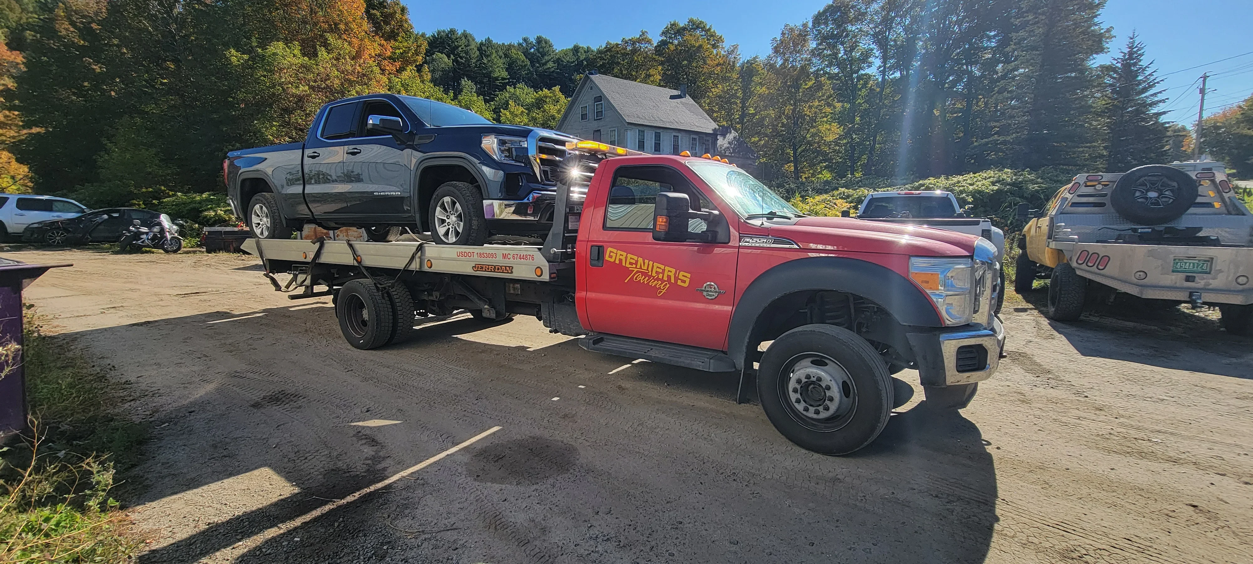 Flatbed Tow Truck Transporting Pickup