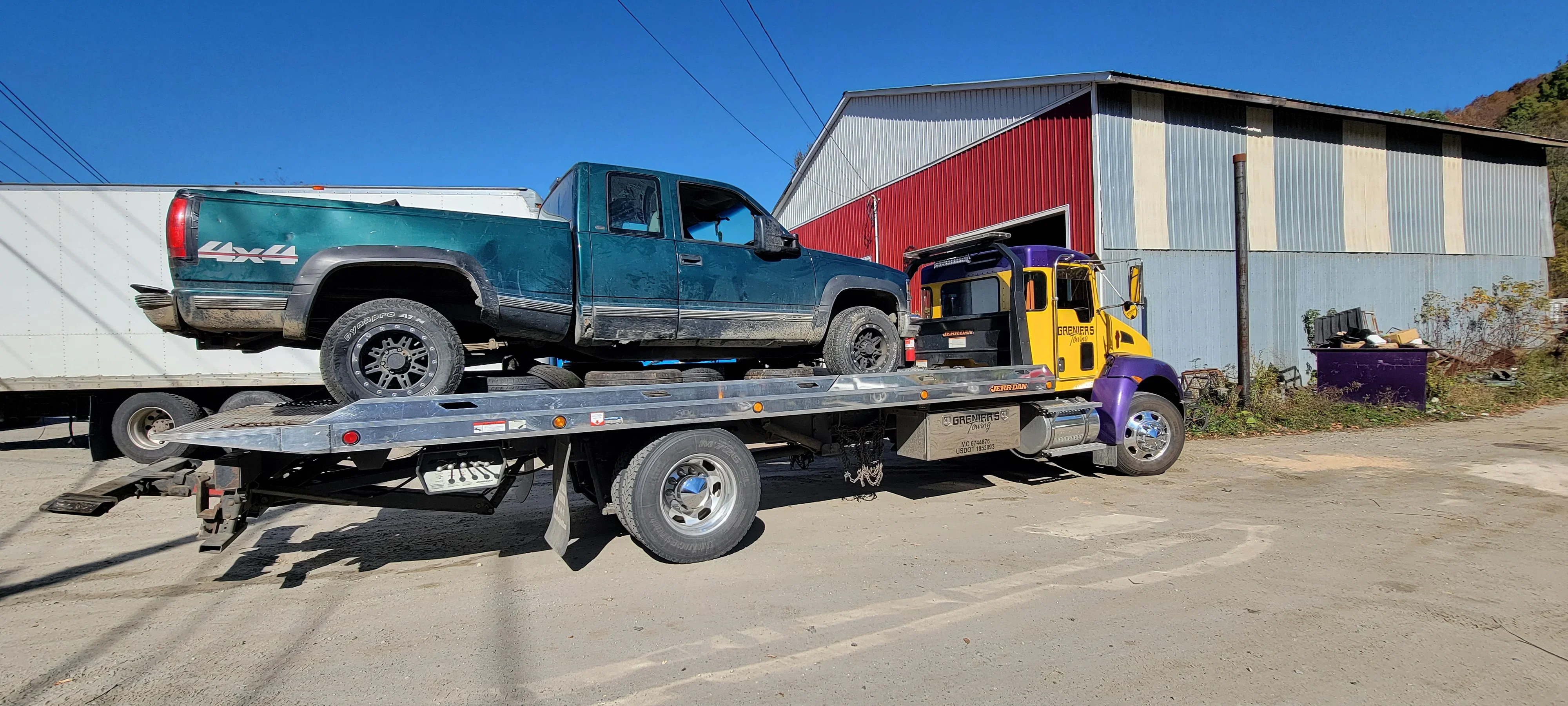 Tow Truck Transporting Pickup