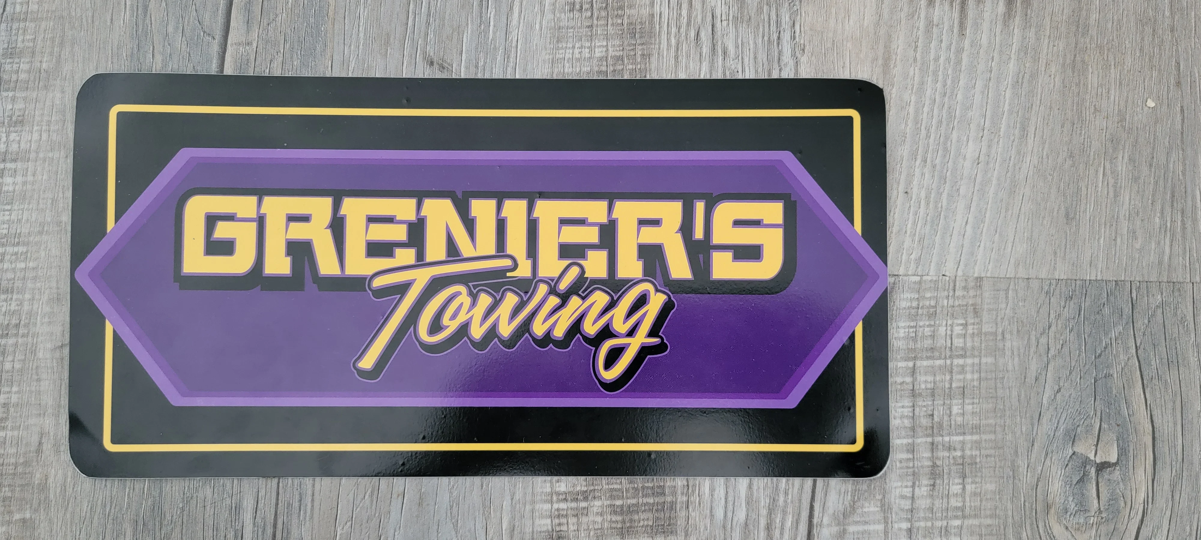 Grenier's Towing Sign