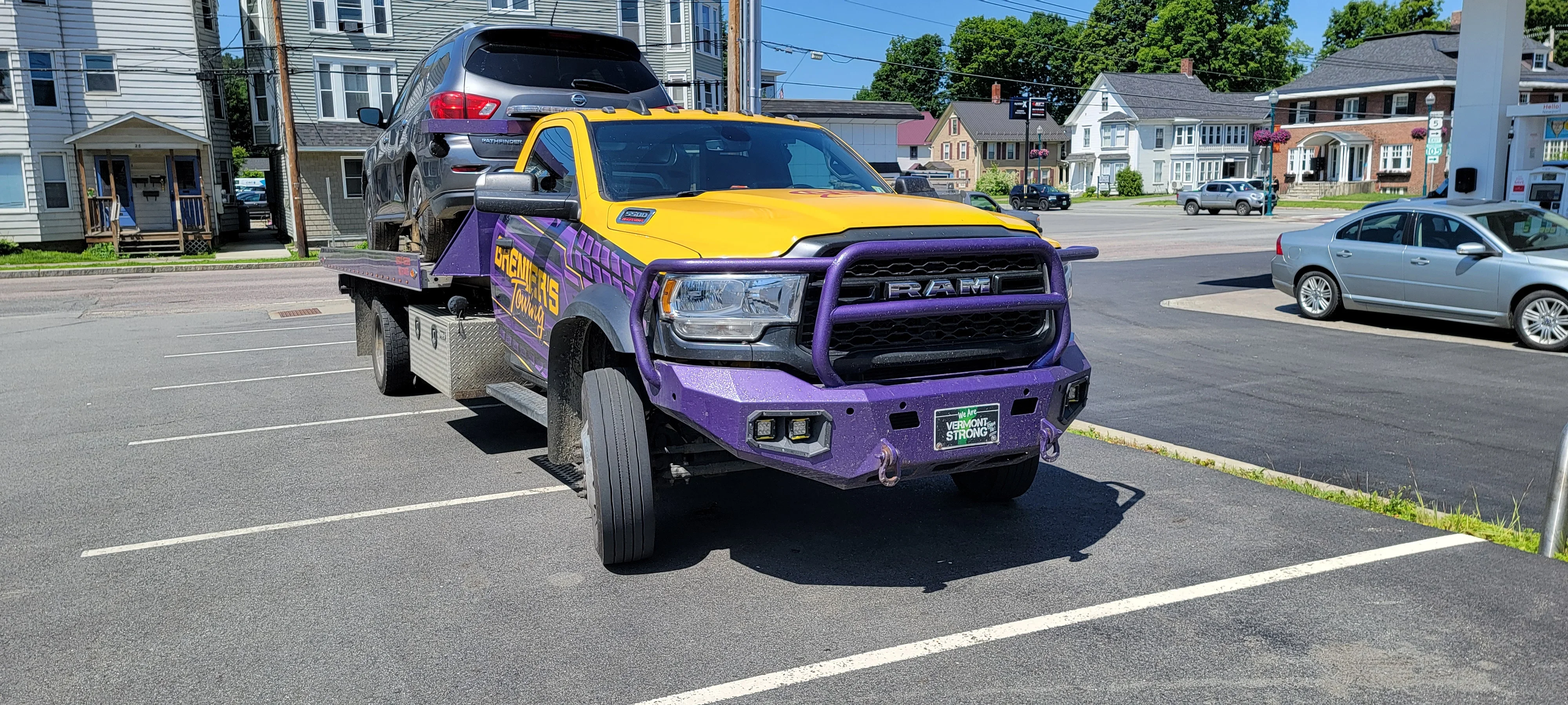 Flatbed Tow Truck Transporting SUV