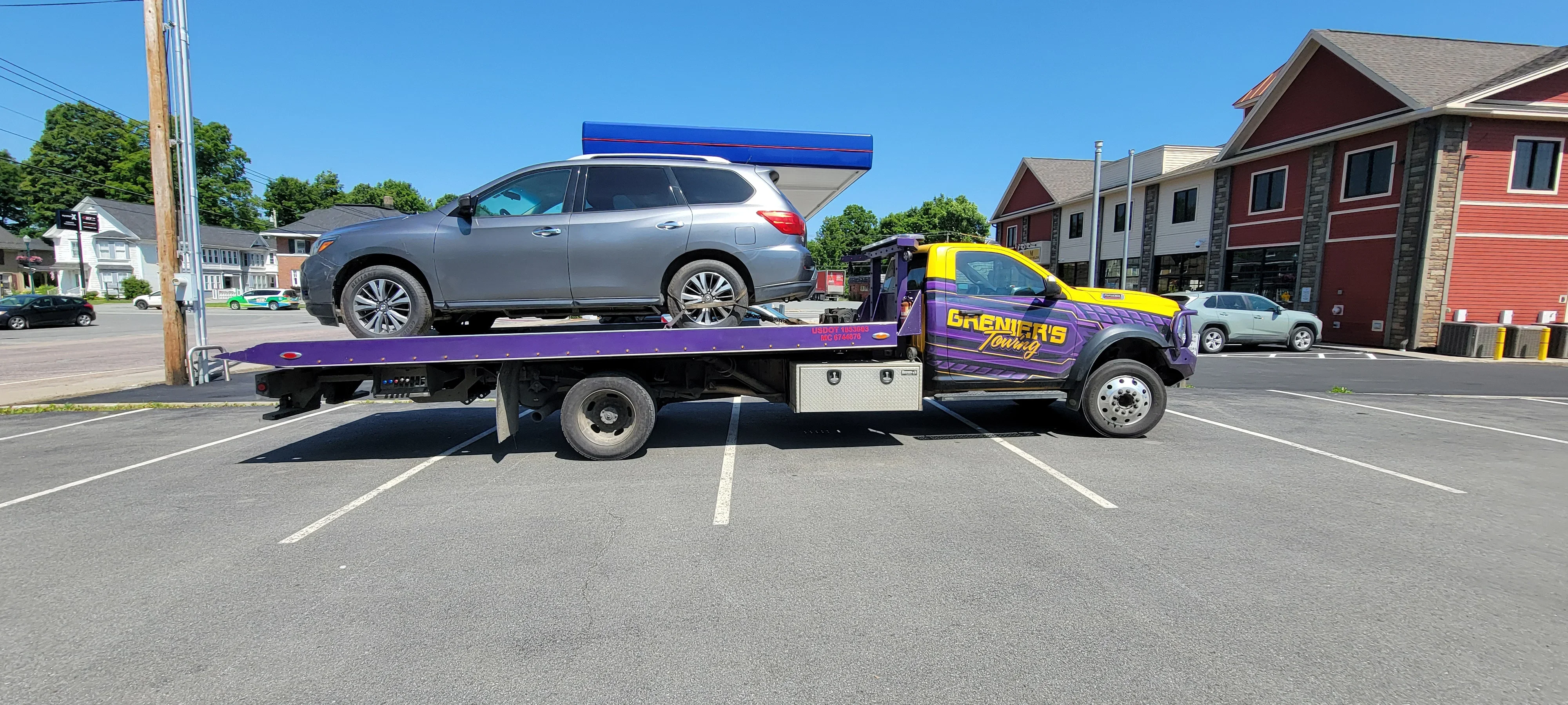 Flatbed Tow Truck Carrying SUV
